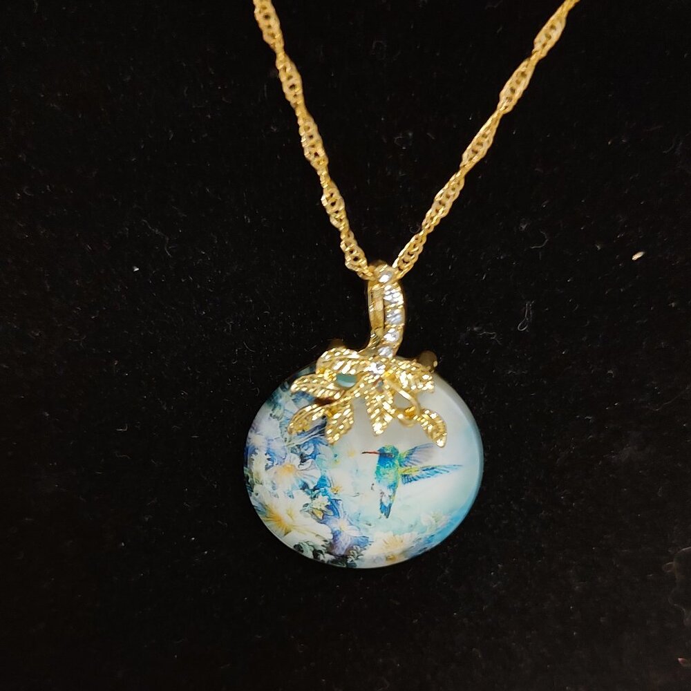 Provided by JA Fashion Jewelry. 11" long. Hummingbird Pendant on a gold chain